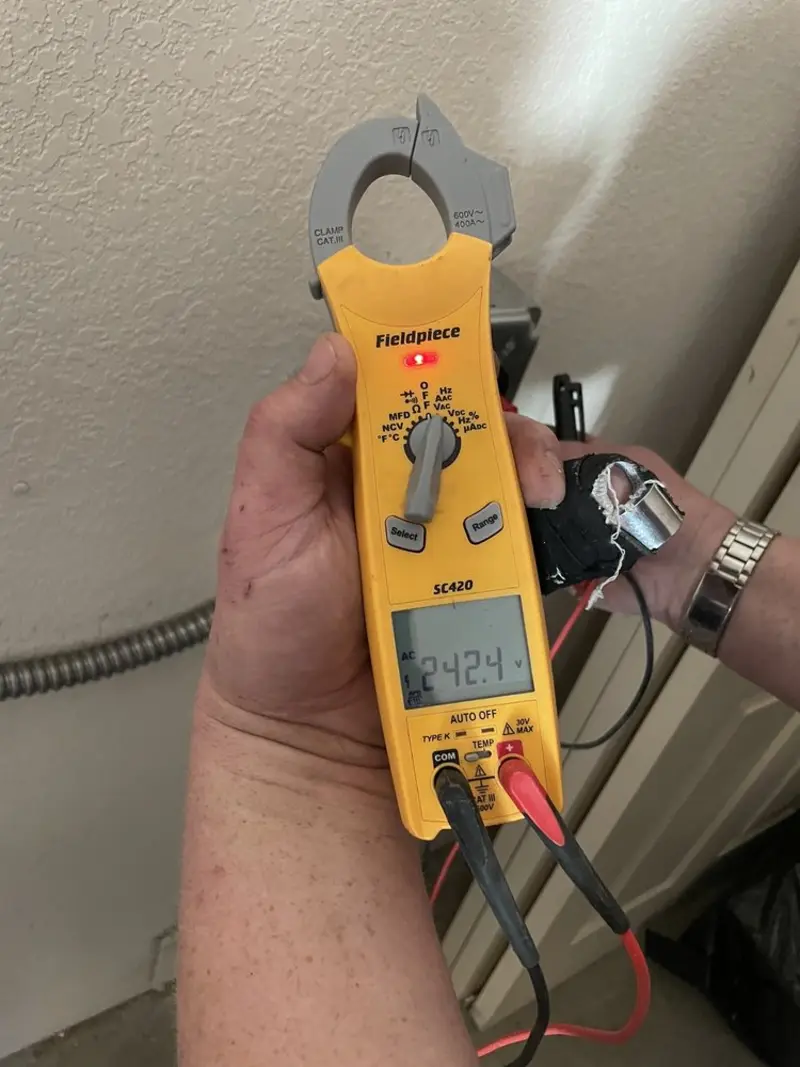 Voltage testing with clamp meter during Generator Installation in Helena Valley Northeast
